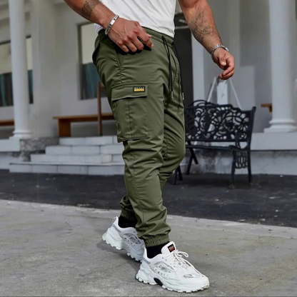 👖50 % DE RÉDUCTION🏃 Pantalon de survêtement de travail | Cordon de serrage à la taille · Polyester résistant · Jambes fuselées · Plusieurs poches