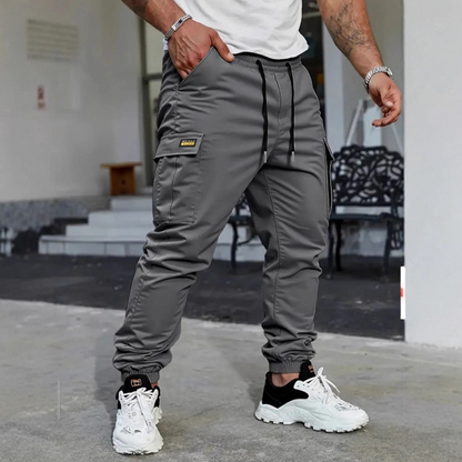 👖50 % DE RÉDUCTION🏃 Pantalon de survêtement de travail | Cordon de serrage à la taille · Polyester résistant · Jambes fuselées · Plusieurs poches
